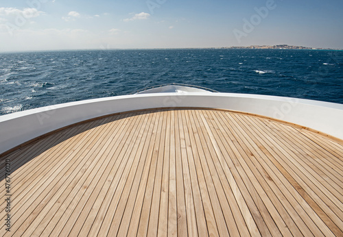 Stampa su tela Table and chairs on deck of a luxury motor yacht