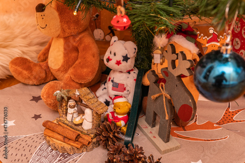 Beautifully decorated Christmas tree with different toys and symbols photo