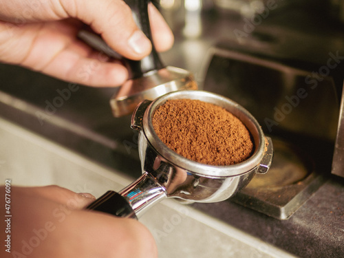 maker pouring espresso