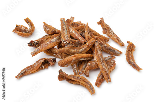 Heap of homemade fried Indonesian ikan teri goreng close up isolated on white background photo