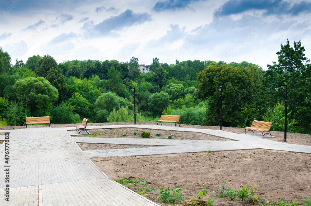 Europe, Russia.City landscape in summer, benches in the city park. Europe, Russia.City landscape in summer, benches in the city park.