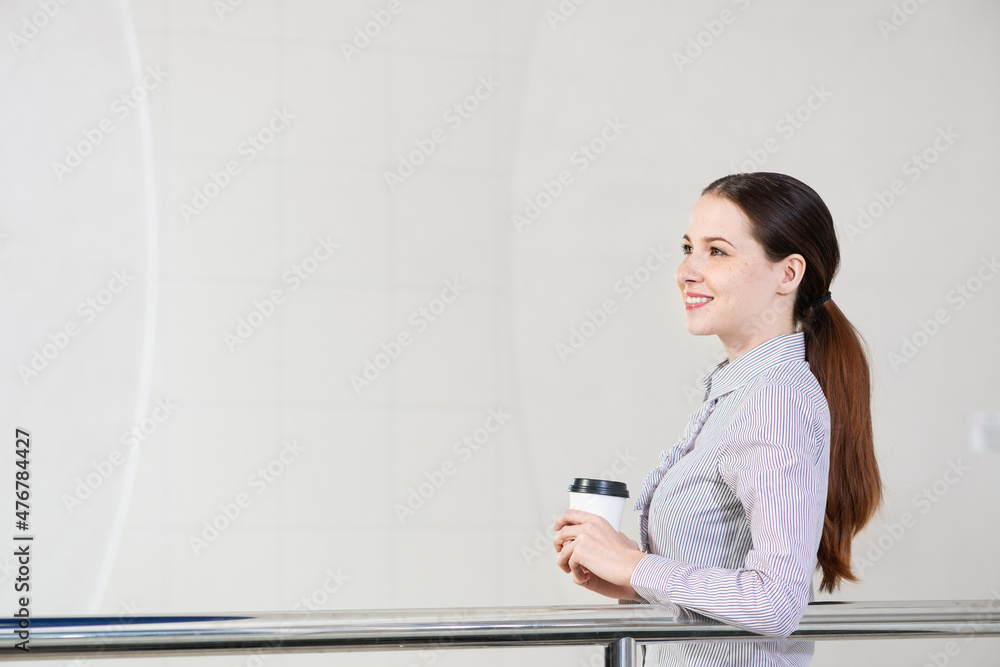 young attractive business woman with a cup of coffee young attractive business woman with a cup of coffee