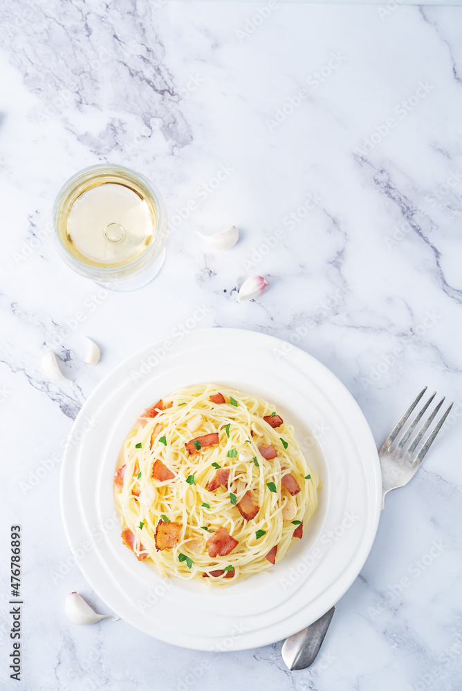 Bacon garlic parsley pasta in a plate Bacon garlic parsley pasta in a plate