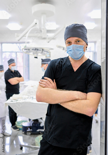 surgeon oversees the operation in the operating room photo