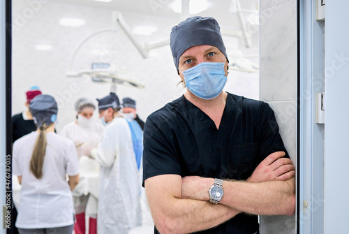 surgeon oversees the operation in the operating room photo