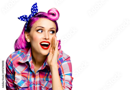 Fotografija Portrait of pinup woman holding hand near open mouth, looking outside and saying something