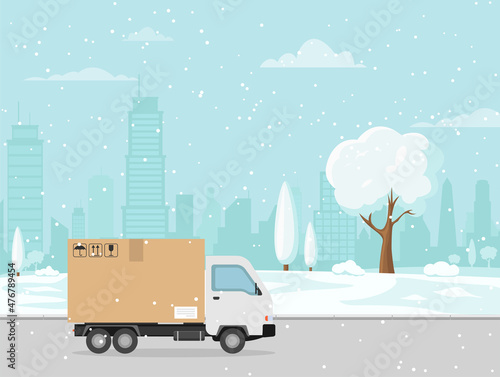Home delivery. delivery truck on the landscape winter city.