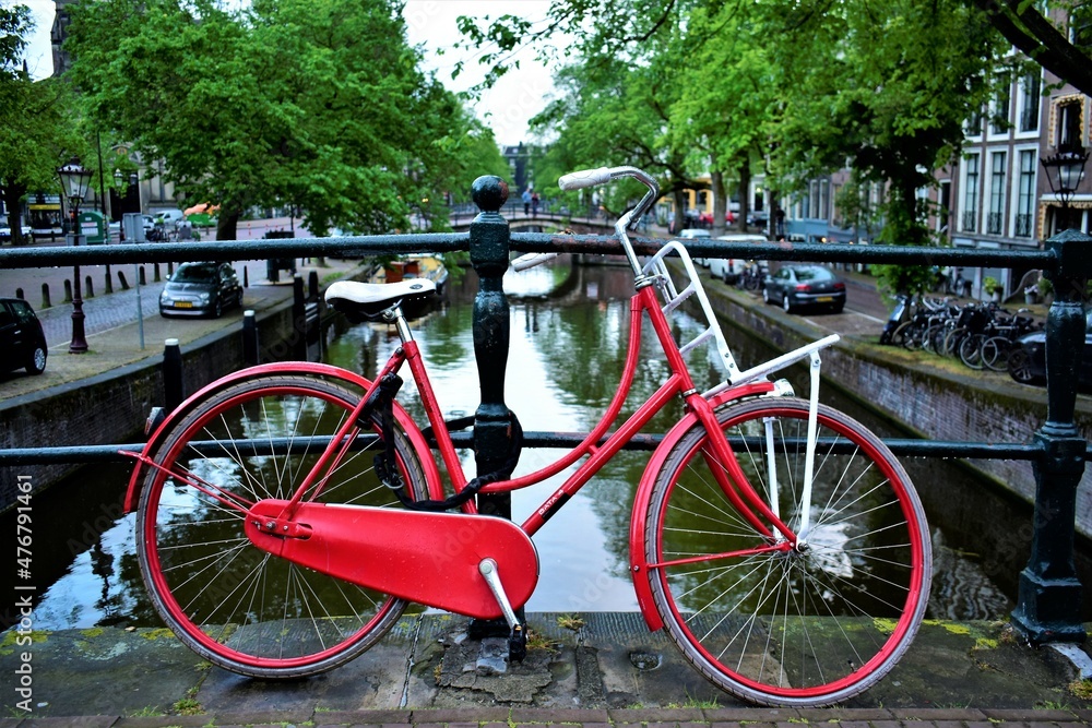 Bold Red bike by Amsterdam canal