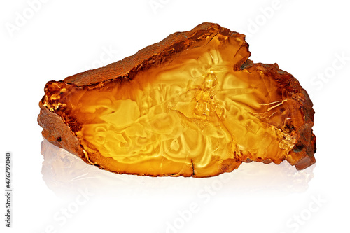 A piece of  raw amber on white.