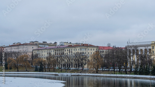 Dark waters of the river with thin plates of ice. The first ice on the river in center of Minsk.