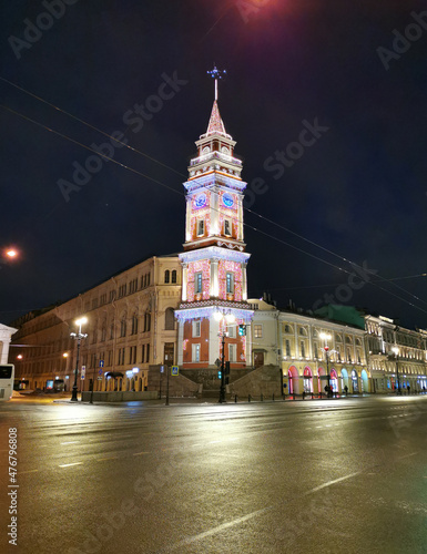 Duma Tower on Nevsky Prospekt in St. Petersburg, decorated with lights and garlands for Christmas and New Year.