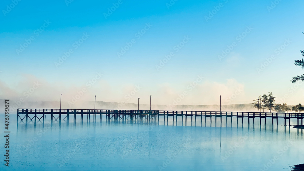 pier at dawn with lake mist