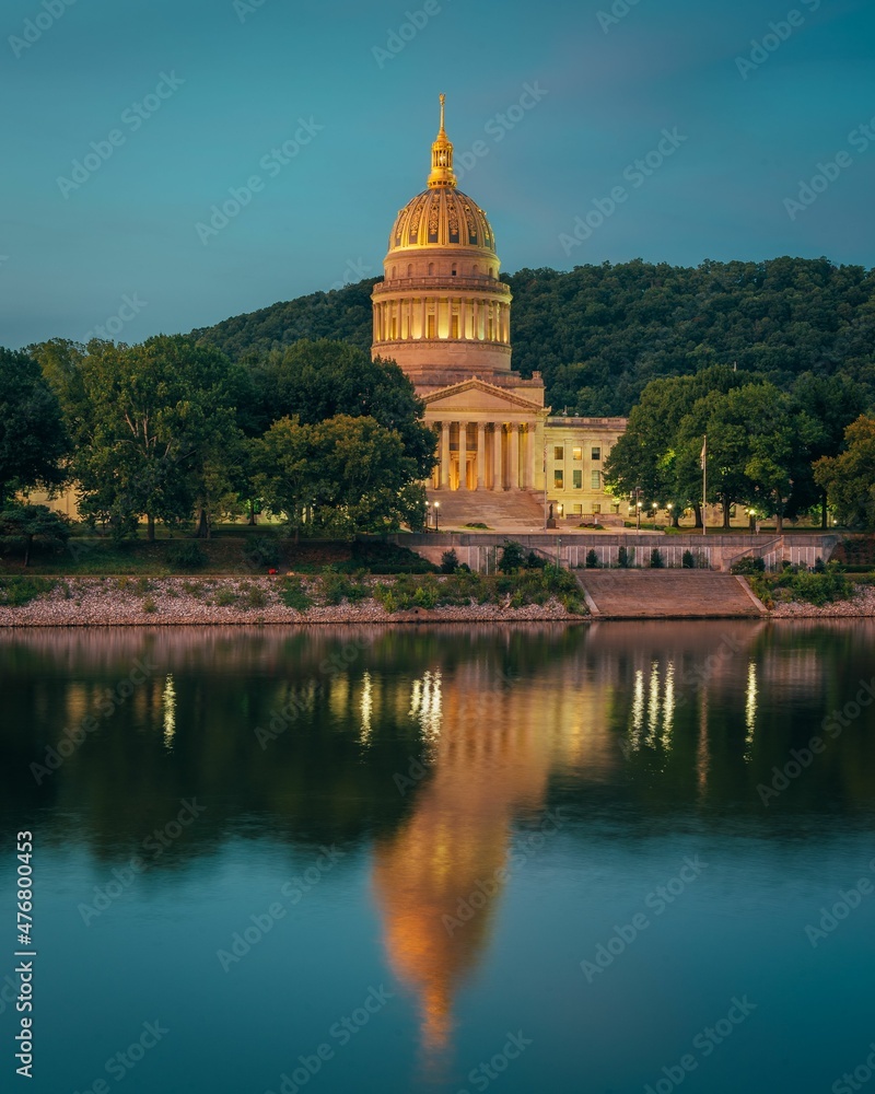 The West Virginia State Capitol and Kanawha River at night, in Charleston, West Virginia