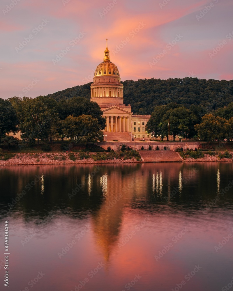 The West Virginia State Capitol and Kanawha River at sunset, in Charleston, West Virginia