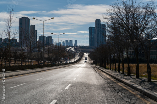 Ankara, Turkey - December 11 2021: The twisting asphalt road and tall buildings in the town of Incek.