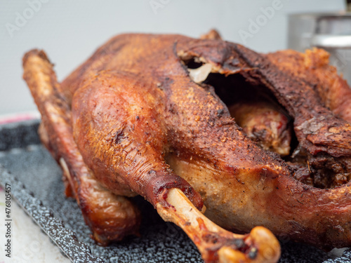 Close up of roast goose with blurred background.