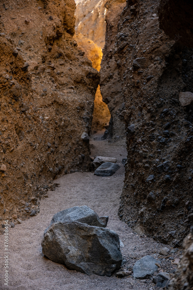 Large Boulders Dot The Path Through Slot Canyon In Death Valley