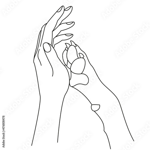 Woman's hand and dog's paw. Friendship