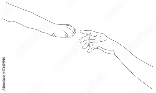 A man's hand and a dog's paw. Friendship and trust