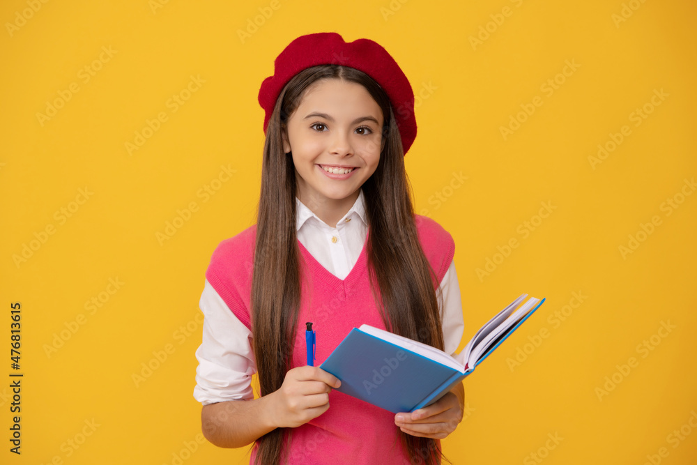 happy teen school girl in french beret making notes in planner notepad or notebook, school happy teen school girl in french beret making notes in planner notepad or notebook, school