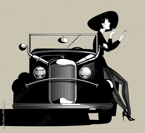 Woman in black dress and hat paints her lips near retro car