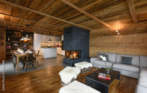 Spacious living room with opened kitchen in a chalet