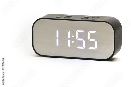 Clock with a time of 11 hours 55 minutes on a white background