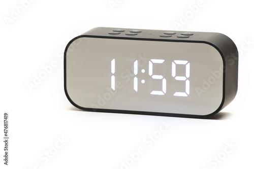 Clock with a time of 11 hours 59 minutes on a white background