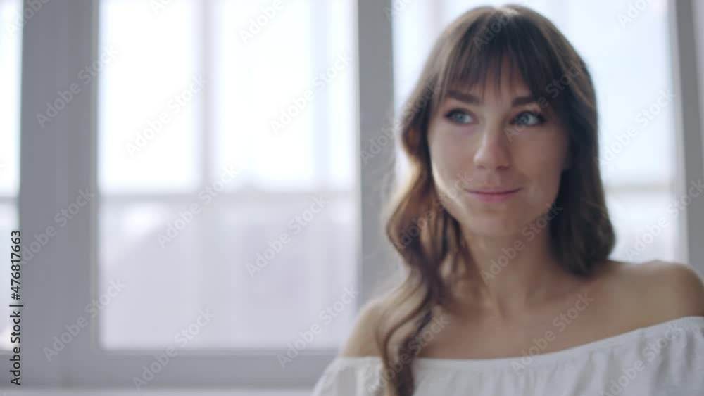 Beautiful lady with leukodermia applying powder and admiring mirror reflection Beautiful lady with leukodermia applying powder and admiring mirror reflection