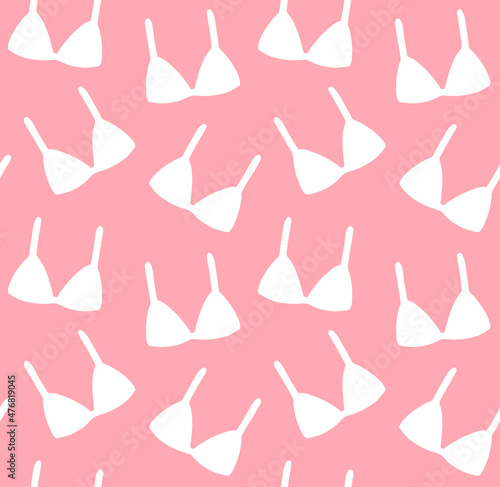 Vector seamless pattern of hand drawn bra silhouette isolated on pink background