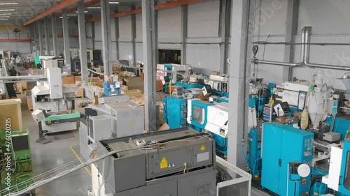 Span in a large workshop with machine tools. Production workshop general plan. Industrial interior of a modern factory