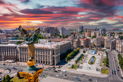 Aerial view of the Kyiv Ukraine above Maidan Nezalezhnosti Independence Monument. Golden beautiful Ukrainian woman statue in the middle of the city. photo
