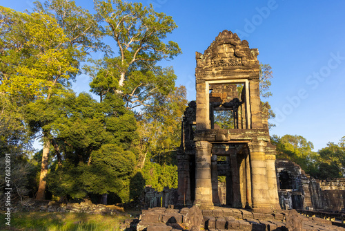 Ruins of Preah Khan temple in Angkor complex, overgrown by trees, Cambodia photo