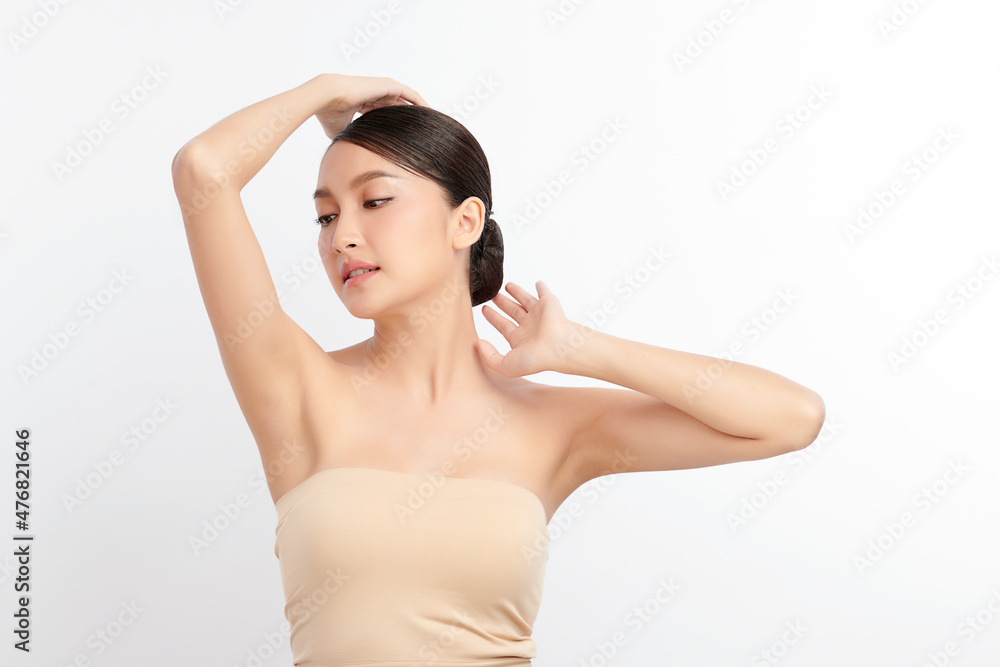 Beautiful Young Asian woman lifting hands up to show off clean and hygienic armpits or underarms on white background, Smooth armpit cleanliness and protection concept Beautiful Young Asian woman lifting hands up to show off clean and hygienic armpits or underarms on white background, Smooth armpit cleanliness and protection concept