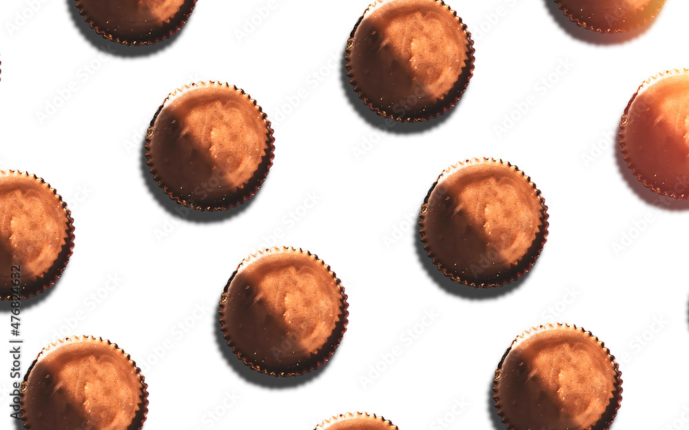 Pattern of peanut butter filled snack covered in chocolate isolated on white Pattern of peanut butter filled snack covered in chocolate isolated on white
