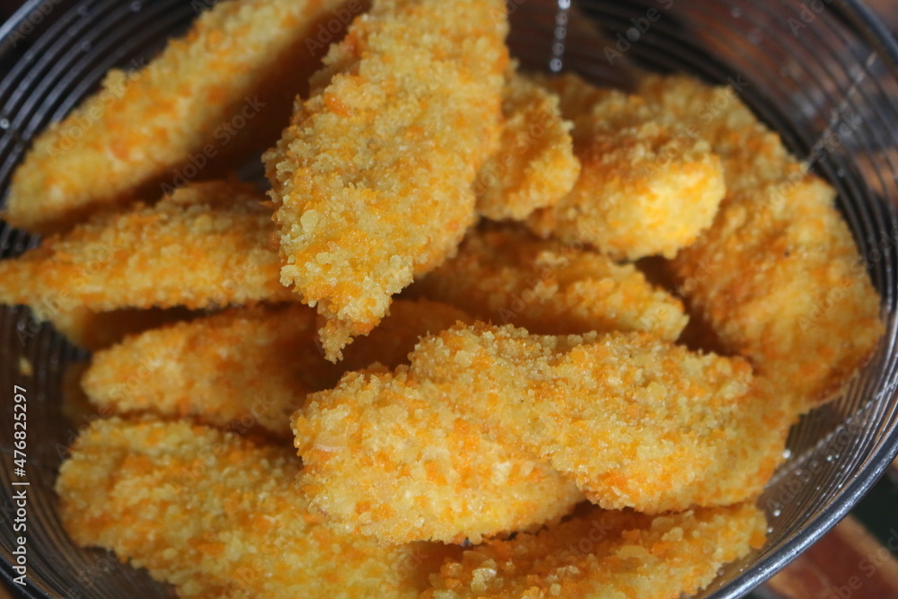 Freshly ripe fried bananas with a brown color made with bananas dipped in a mixture of liquid flour and breadcrumbs Freshly ripe fried bananas with a brown color made with bananas dipped in a mixture of liquid flour and breadcrumbs