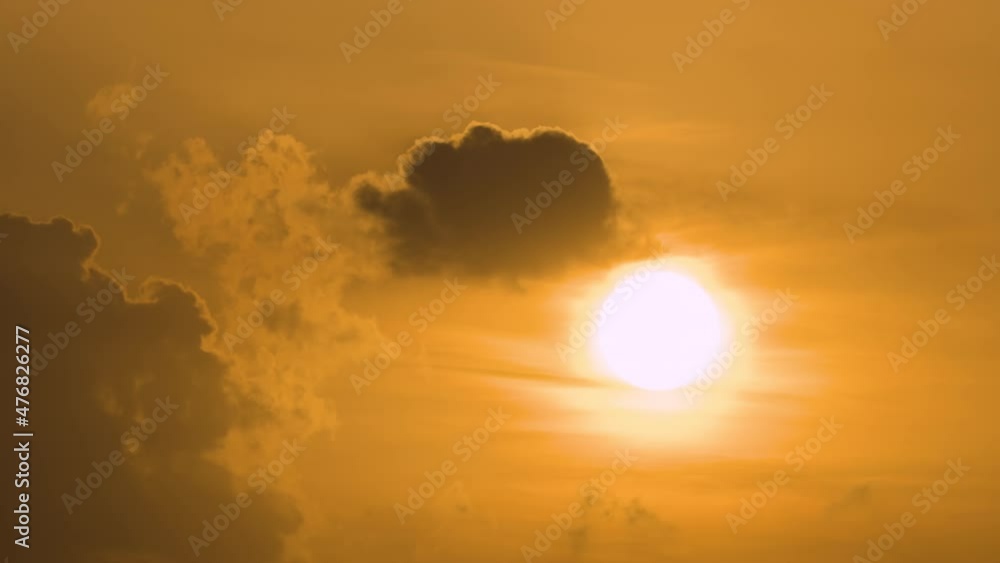 Bright colorful sunset sky with rays of setting sun and vivid dark clouds Bright colorful sunset sky with rays of setting sun and vivid dark clouds