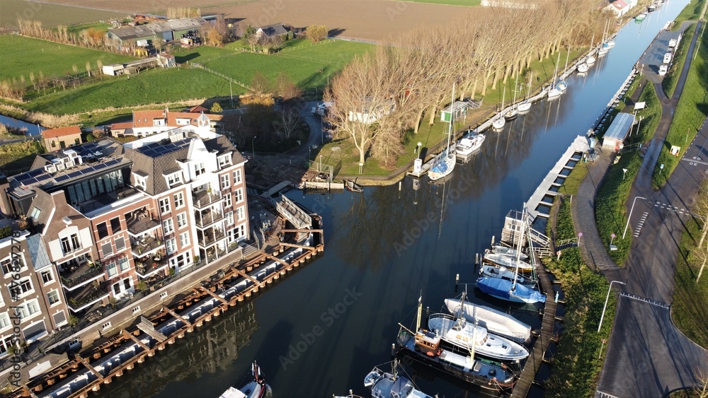 Harbor town on Goeree Overflakkee in the Netherlands with the residential area around the newly constructed harbour. Traditional new construction.