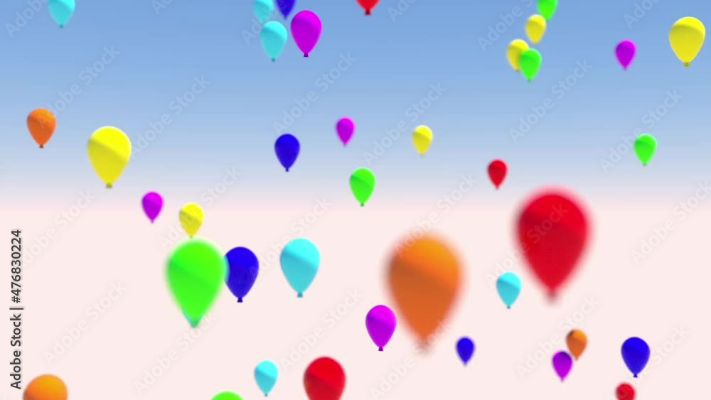 Against the background of a light blue sky, multi-colored balloons make a smooth vertical rise. Bokeh effect. Against the background of a light blue sky, multi-colored balloons make a smooth vertical rise. Bokeh effect.