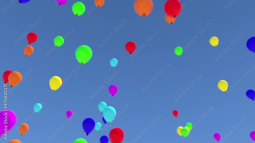 The camera watches as many colorful balloons rise at an angle into the blue sky. Bokeh effect. The camera watches as many colorful balloons rise at an angle into the blue sky. Bokeh effect.
