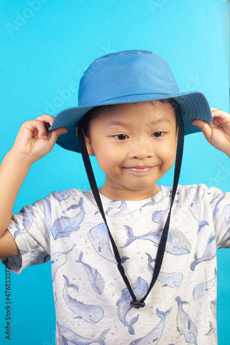 Close-up portrait of asian child boy he nice looking creating new idea solution fantasize copy space isolated blue color background