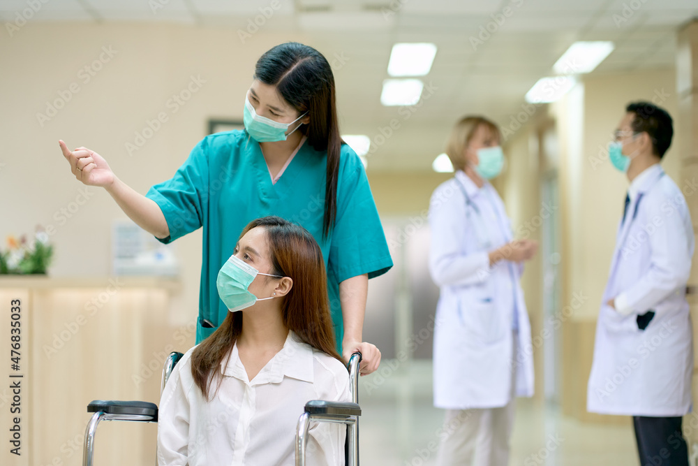 Scene of hospital with patient and nurse doctors in lobby Scene of hospital with patient and nurse doctors in lobby
