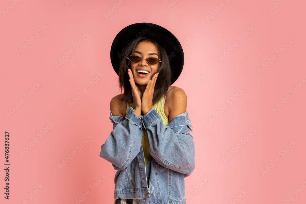 Nice smiling stylish woman in spring outfit posing over pink backgrond in studio. Nice smiling stylish woman in spring outfit posing over pink backgrond in studio.