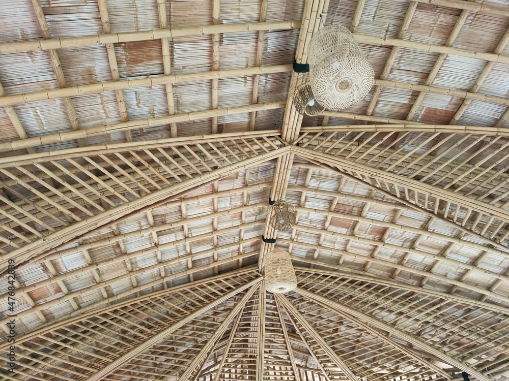 The lamp and the roof are made of bamboo.