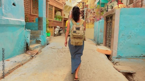 Female tourist walks through the streets of an Indian city. Rajasthan, Indian Jodhpur Also blue city photo