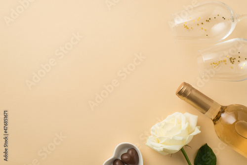 Wallpaper Mural Top view photo of valentine's day decor white rose two wineglasses with golden sequins heart shaped saucer with chocolate candies and bottle of white wine on isolated beige background with copyspace Torontodigital.ca