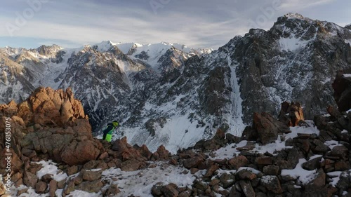 Wallpaper Mural Aerial shoot of a running man at a mountain landscape in winter Torontodigital.ca