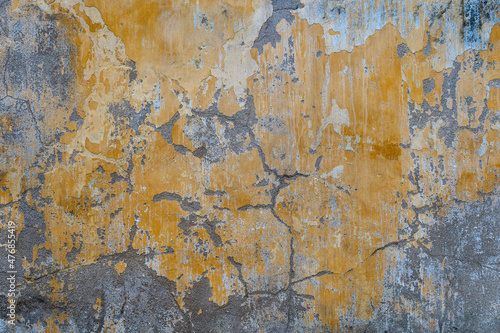 Background of old yellow painted wall, close up texture