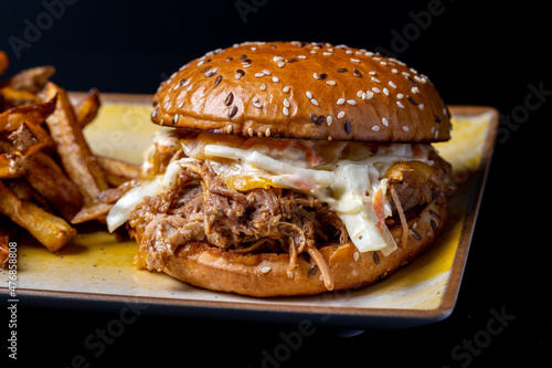 Wallpaper Mural details of tasty pulled pork hamburger with fries on black background Torontodigital.ca