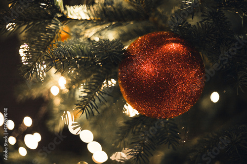 Detail photo of a christmas ball and christmas lights of one of the two christmas trees on the Regentesseplein in The Hague, the Netherlands.  